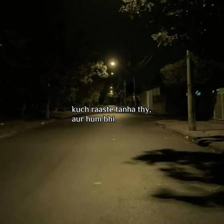 Alone Sad Shayari for an empty road glowing under night streetlights