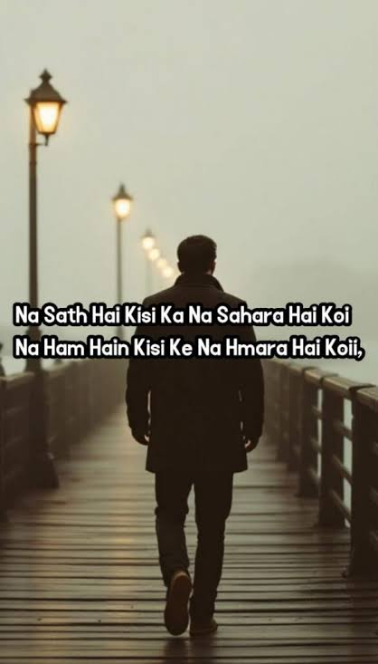  Alone Sad Shayari for a lonely man walking through a quiet city street at night