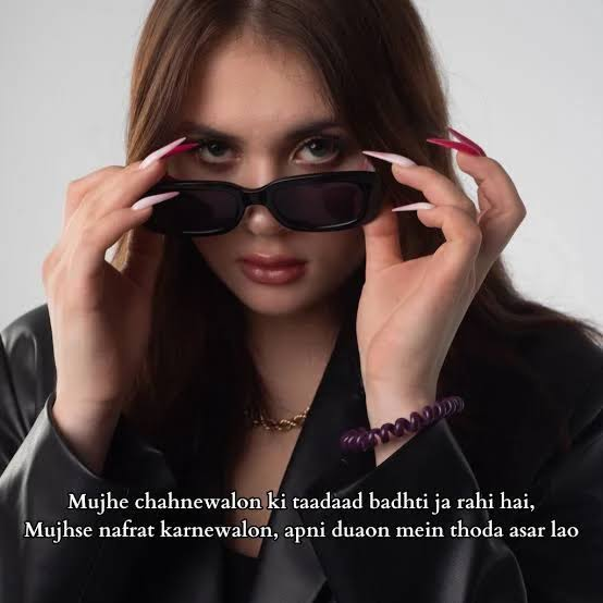 Attitude Nafrat Shayari showing a confident woman in a modern city setting with a bold expression