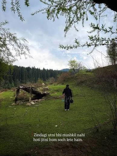 Sad Shayari On Life Marathi showing a peaceful empty path surrounded by green hills