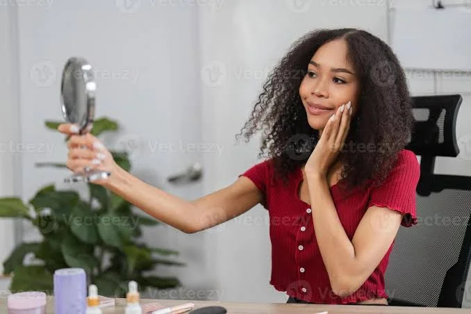 Self Love Shayari In English showing a woman smiling at her mirror while celebrating body confidence
