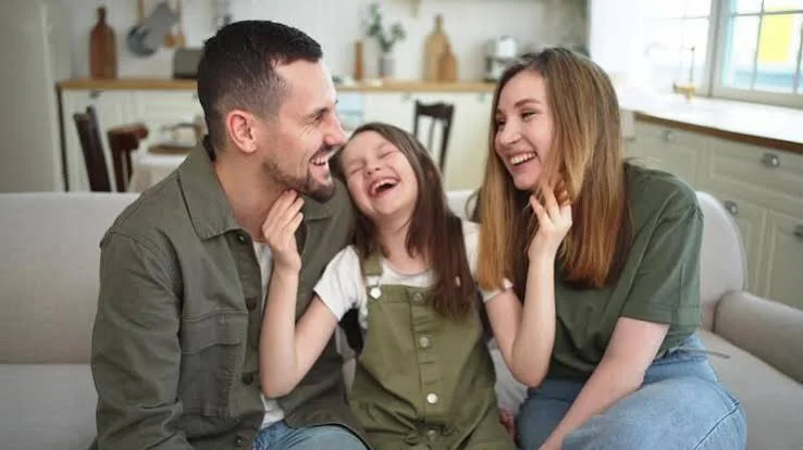 Papa Beti Shayari showing a father and daughter smiling together during a warm indoor family moment